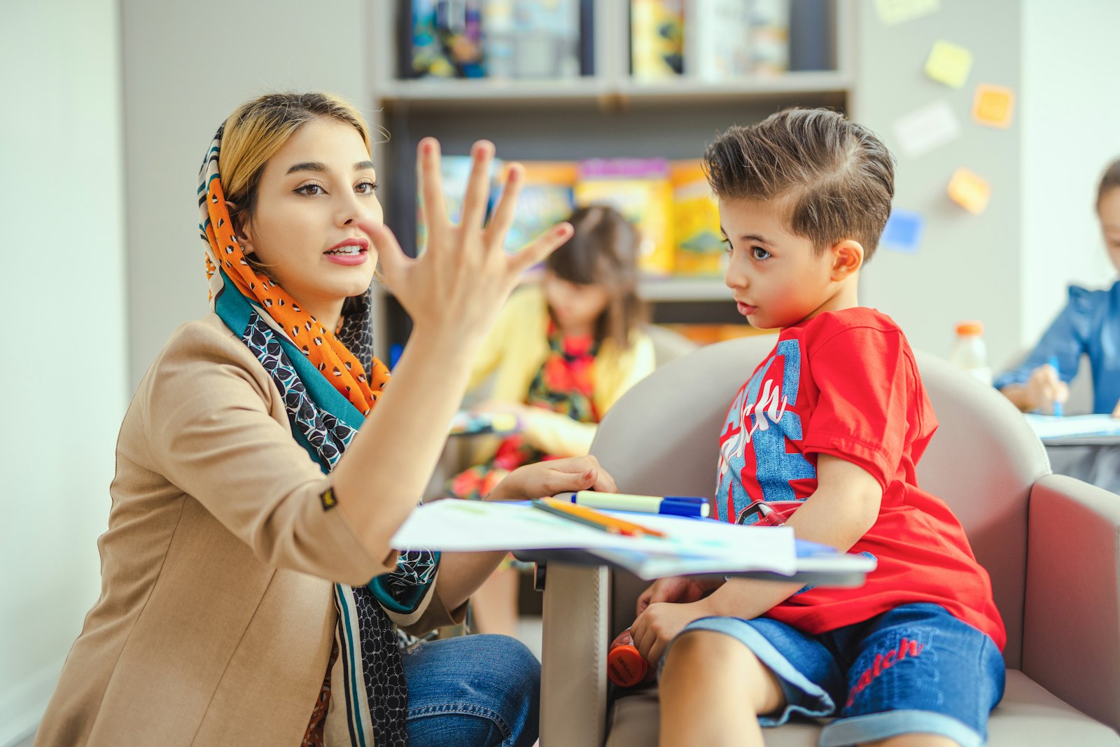 An educator talking with a child